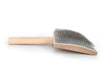 A wooden hand carder brush with a light natural wood handle and a wide, angled wooden bristle head, shown on a plain white background.