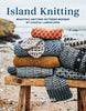 Book cover of 'Island Knitting' by Erika Aberg with knitted sweaters on a wooden stool by a beach.