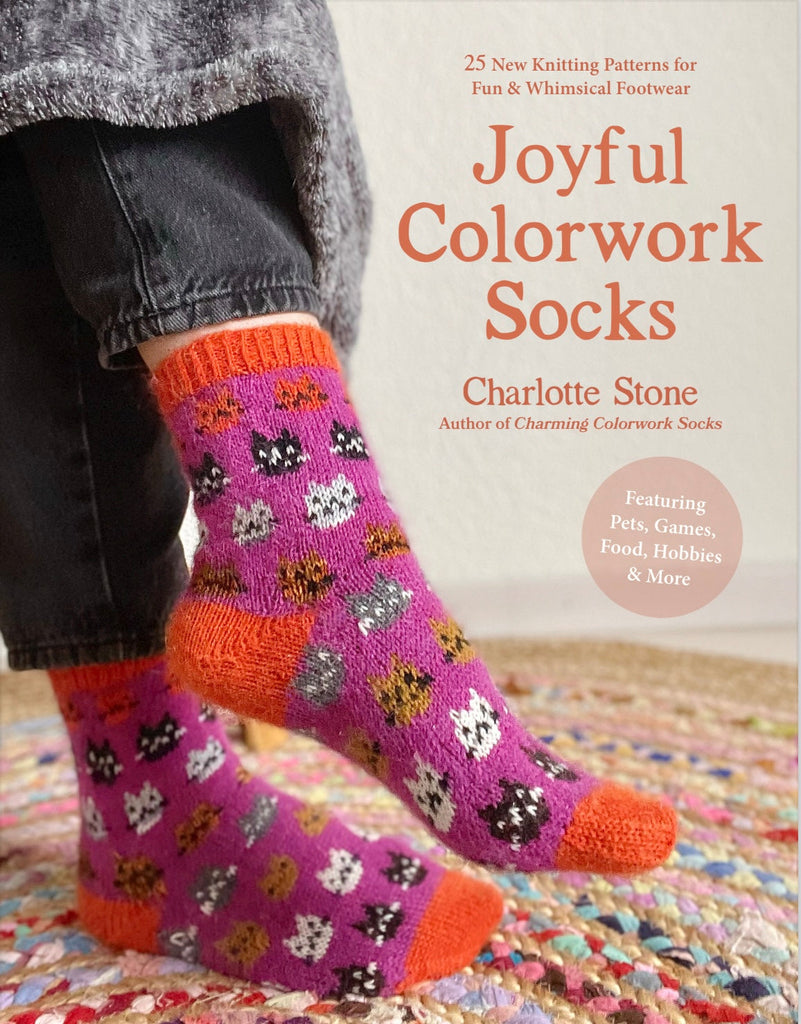Book cover of 'Joyful Colorwork Socks' by Charlotte Stone with a person wearing colorful knitted socks.