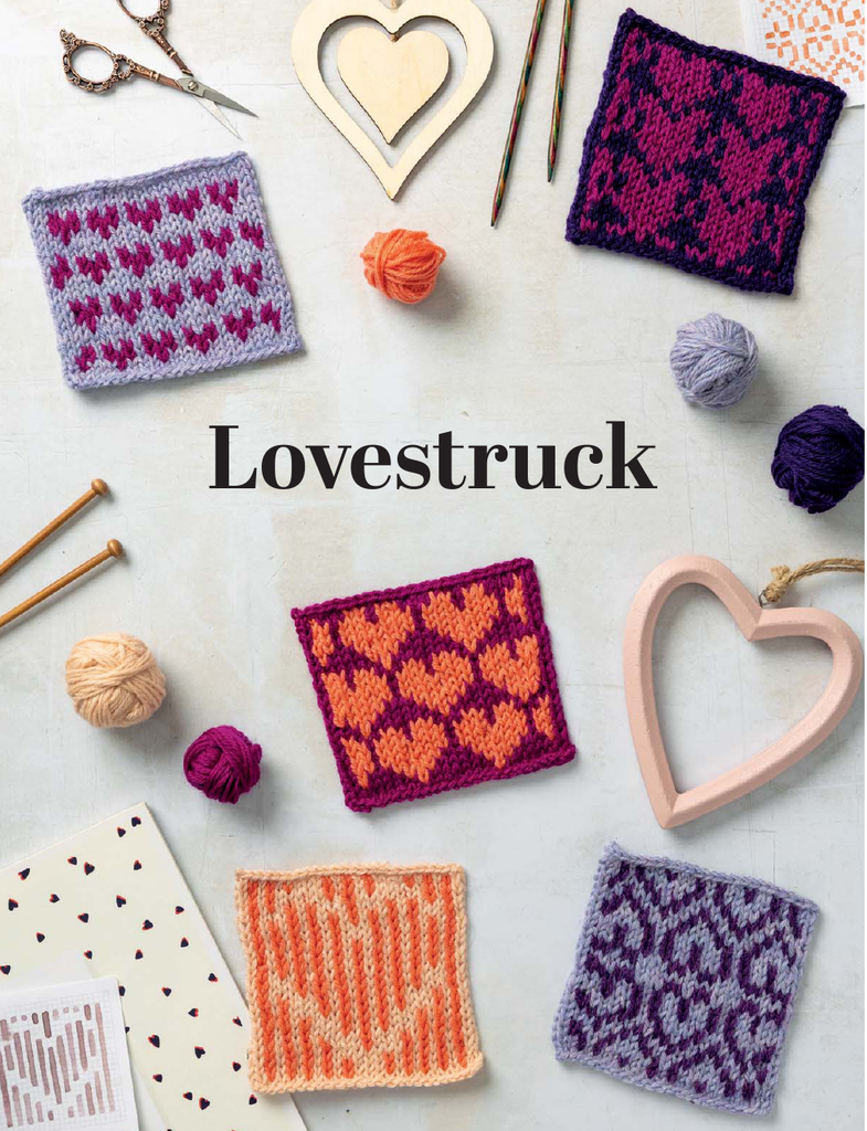 A flat lay of knitted heart-pattern swatches in multiple colors, arranged with knitting needles, yarn balls, scissors, wooden heart ornaments, and patterned paper on a light background. The word 'Lovestruck' is printed in the center.