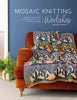 Book cover of 'Mosaic Knitting Workshop' with a knitted blanket on an orange couch against a blue wall.