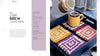 A printed recipe-style spread for 'Deja Brew Coasters' shows the left page with text and the right page with a hand pouring liquid over a yellow mug placed on crocheted coasters on a tray.