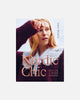 A book cover titled 'Nordic Chic: Knitting a Modern Wardrobe' by Lesli Holmes, featuring a portrait of a woman in a dark knit sweater with a light fur collar against a pale background.