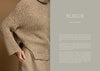 Beige knitted sweater worn by a person on a brown background with text overlay.