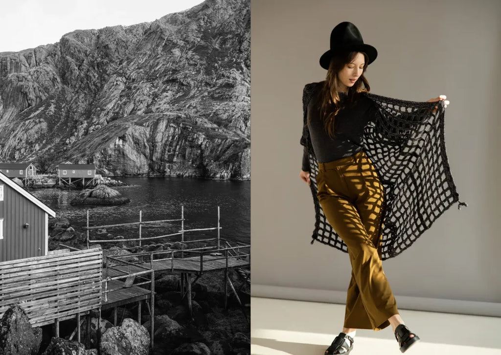 Person holding a black lace shawl with a scenic coastal view on the left