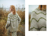 Woman wearing a patterned sweater standing in a field with a close-up of the sweater's design.