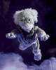 A crocheted amigurumi doll of a ghostly wizard or elf with white yarn hair, blue eyes, and a gray-and-white striped sweater, floating against a dark purple background with soft white cloud-like shapes at the bottom.
