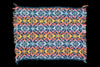 Colorful knitted fabric with geometric pattern on a black background