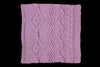 Purple knitted fabric with a decorative pattern on a black background