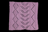 Purple knitted fabric with a geometric pattern on a black background