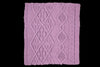 Purple knitted fabric with a diamond pattern on a white background