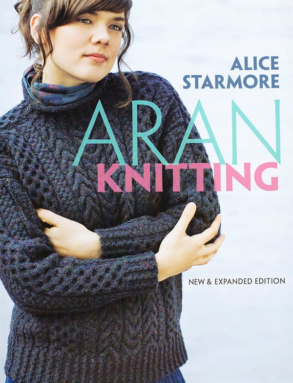 Book cover of 'Aran Knitting' by Alice Starmore featuring a person wearing a knitted sweater.