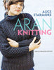 Book cover of 'Aran Knitting' by Alice Starmore featuring a person wearing a knitted sweater.