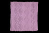 Purple knitted fabric with a geometric pattern on a black background