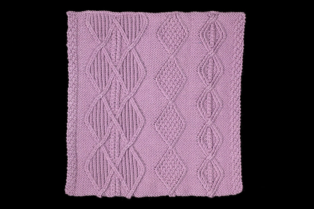 Purple knitted fabric with a geometric pattern on a black background