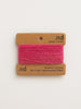 Pink cashmere yarn on a branded card with 'nd' on a white background