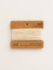 Reclaimed cashmere yarn on a branded card with 'nd' logo on a light beige background