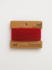 Red yarn on a brown card with 'nd' branding on a white background