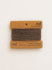Reclaimed cashmere yarn on a branded card with 'nd' label on a beige background
