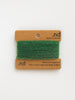 Green cashmere yarn on a brown card with 'nd' branding on a white background
