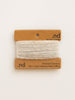 Reclaimed cashmere yarn on a branded card with 'nd' logo on a white background