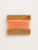 Peach-colored yarn on a brown card with 'nd' branding on a white background