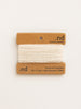 Reclaimed cashmere yarn on a branded card with 'nd' logo on a white background