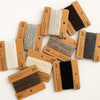 Collection of fabric swatches with brown cards on a white background