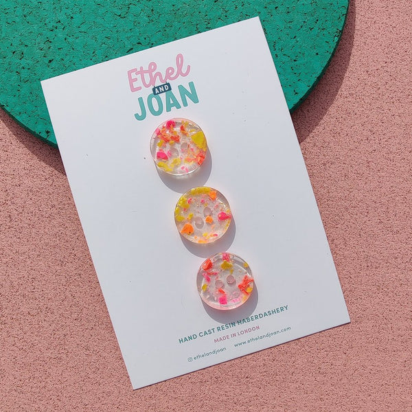set of 3 resin buttons with orange and pink flecks