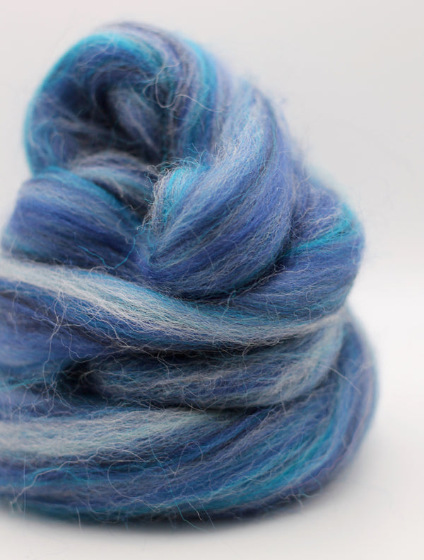 Blue and gray yarn skein on a white background