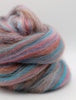 Multicolored skein of yarn on a white background