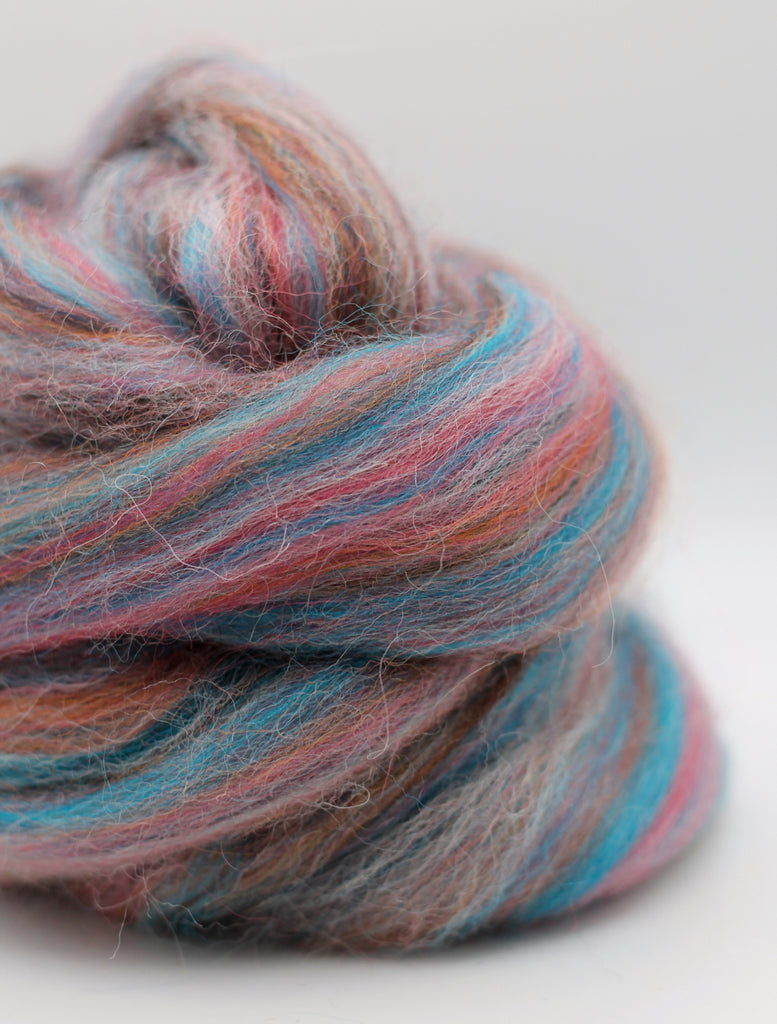 Multicolored skein of yarn on a white background