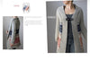 Gray cardigan with patterned sleeves worn by a person, displayed against a neutral background.