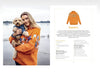 Woman wearing an orange sweater with a dog by a lake, next to a sweater design illustration.