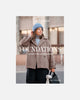 Book cover of 'Foundations' by Sari Nordlund featuring a person wearing a coat and blue knit hat.