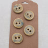 Five ceramic buttons on a brown card with a white background