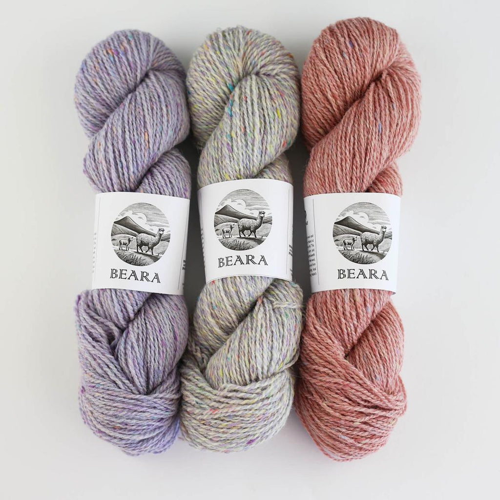 3 skeins of yarn on a white background
