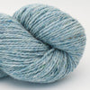 Blue skein of yarn on a white background