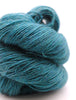 Teal skein of yarn on a white background