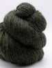Knotted skein of dark green yarn on a white background