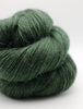 A close-up of a skein of dark forest green yarn with a soft, fuzzy texture, photographed on a clean white background.