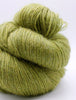 Green skein of yarn on a white background