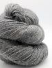 Gray skein of yarn on a white background