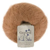 Ball of brown yarn with a 'Gepard Kid Seta' label on a white background