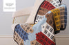 Knitted blanket with architectural pattern draped over a chair