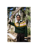 Person wearing a green sweater with a colorful pattern in a forest setting