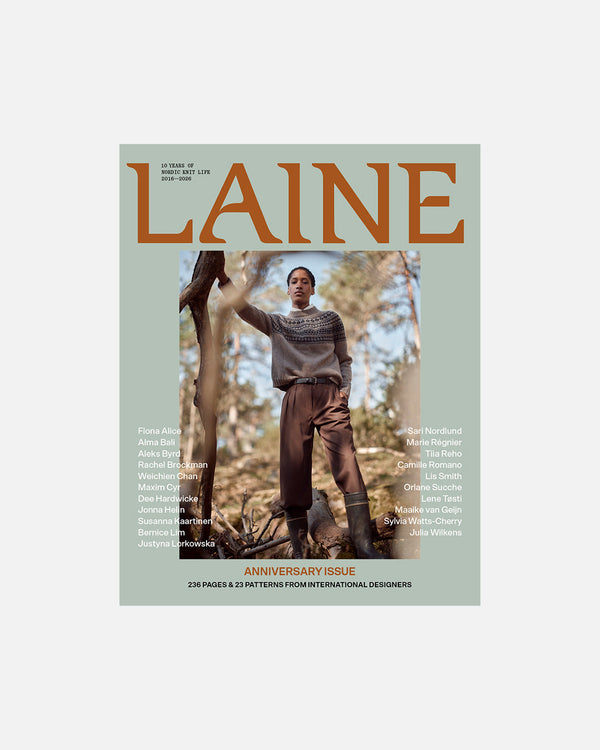 Magazine cover featuring a person in a forest with 'Laine' branding.