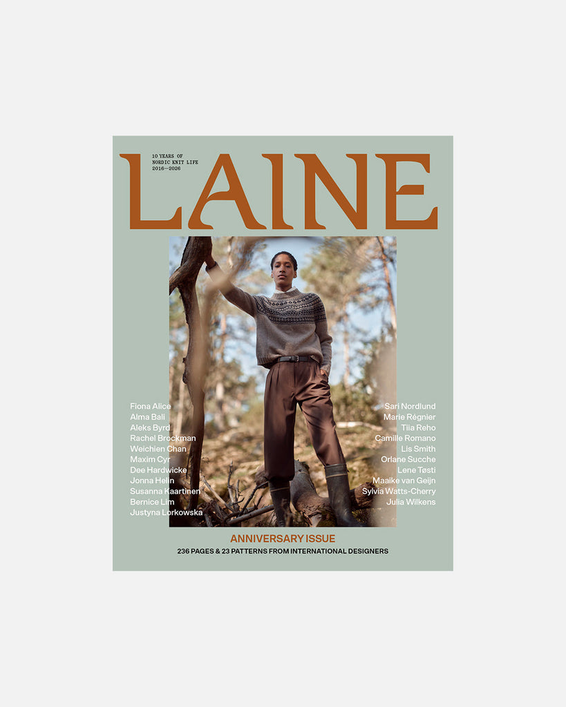 Magazine cover featuring a person in a forest with 'Laine' branding.