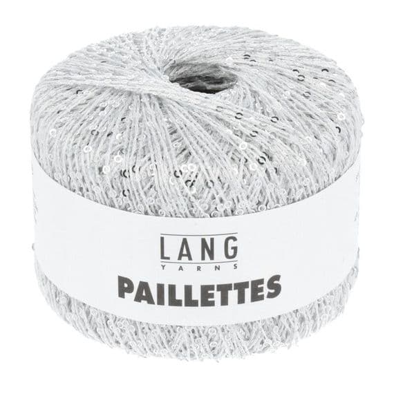 A ball of silver paillette yarn with a white paper label reading 'LANG YARNS PAILLETTES' on a plain white background.