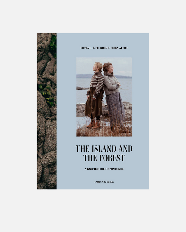 Book cover of 'The Island and The Forest' with a photo of two people on a beach and text.